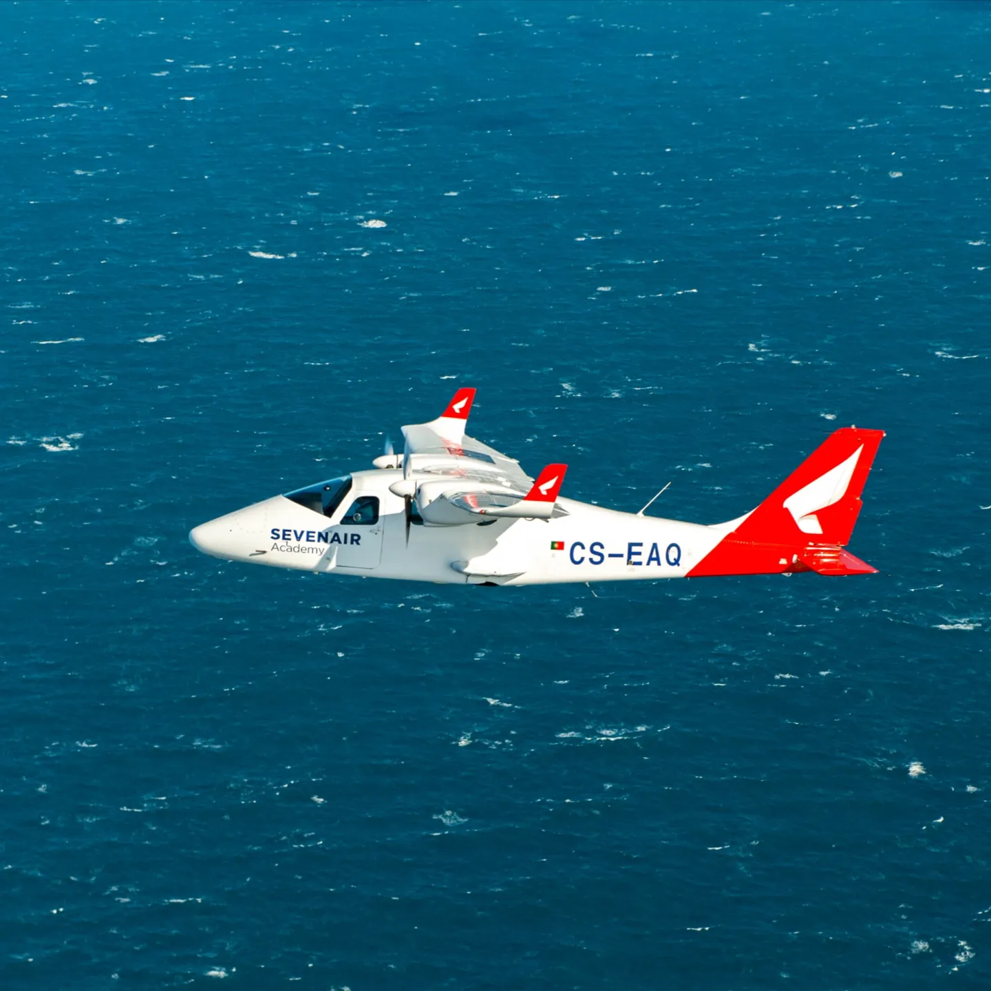 Image of a sevenair plane flying over the water
